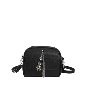 Black crossbody shoulder bag for women with cute tassel and bear pendant design casual daily use