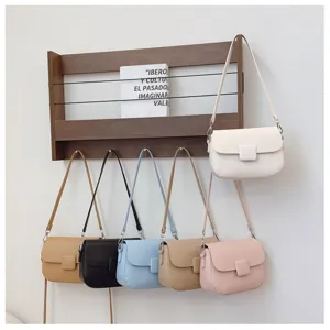 Stylish litchi pattern leather shoulder bag with chic square clasp for women daily use.