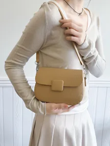 Stylish casual crossbody shoulder bag with textured flap design for women daily fashion.