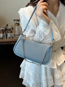 Stylish light blue shoulder bag for women, trendy underarm bag with chain strap and chic design.