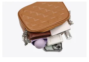 Detailed view of the brown quilted soft leather crossbody bag showing inner storage capacity.