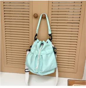 Mint green bucket shoulder bag with drawstring closure, casual daily tote for women and girls.