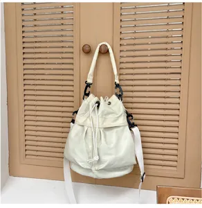 Cream white drawstring bucket bag detail, casual large capacity shoulder tote bag for women.