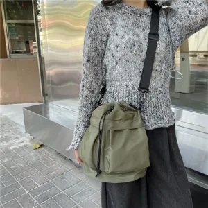 Army green nylon bucket shoulder bag, casual large capacity tote for autumn and winter.