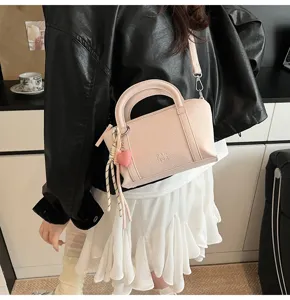 Pink lychee pattern mini pillow handbag detail view, stylish shoulder crossbody bag for women.