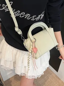 Trendy litchi pattern pillow handbag for women, stylish spring and summer shoulder bag.