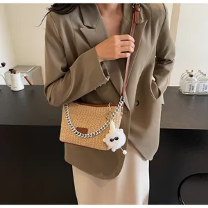 Woven straw shoulder bag detail, chic metal chain decor, cute fluffy plush pendant charm