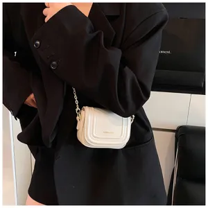 Chic minimalist white crossbody bag with gold chain strap for women, trendy fashion shoulder bag.
