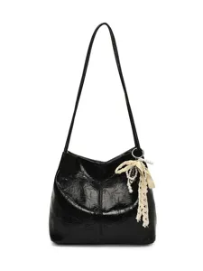 Black crinkled patent leather shoulder bag with chic lace pearl bow pendant for women.