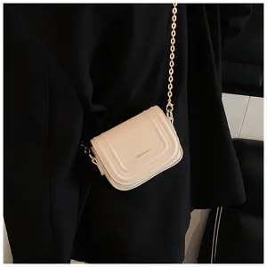 Chic beige leather mini cross-body bag featuring a luxurious gold chain strap and flap design.