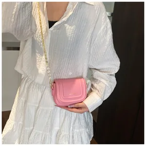 Stylish pink crossbody bag for women with gold chain strap, perfect for daily casual wear.
