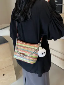 Stylish rainbow woven bucket bag for women 2025 summer new casual straw crossbody bag with chain.