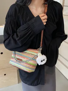 Colorful woven straw bucket bag for women, summer crossbody bag with chain and cute pendant.