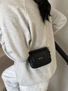 Stylish black leather crossbody bag with chic gold chain strap for women daily casual wear.