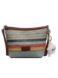 Colorful woven straw bucket bag with brown PU leather trim and cute keychain for summer.