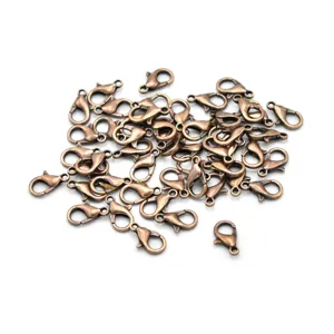Close-up of antique copper lobster clasps for DIY jewelry making, durable metal findings.