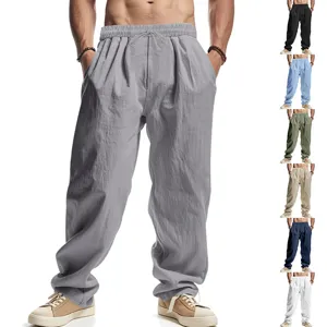 Detailed view of men's casual linen pants with elastic drawstring waist and side pockets.