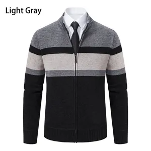 Men's color-block knit cardigan detail showing zip-up mock neck and ribbed cuffs texture.