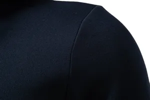 Close-up view of men's casual hooded sweatshirt shoulder seam, showing clean dark blue fabric.