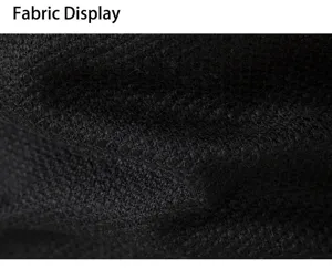 Close-up detail shot of the thick black knitted fabric for men's winter cardigan jacket.