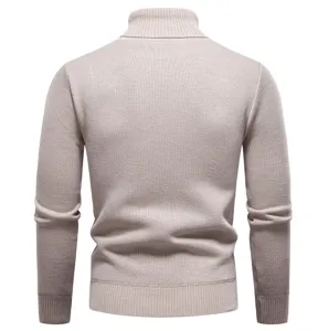 Back view of thick ribbed mock neck knitwear, cozy knit texture and elastic hemline details.