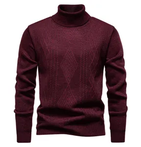 Detail shot of men's burgundy turtleneck sweater featuring classic cable knit diamond pattern.