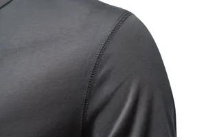 Close-up detail of men solid color short sleeve t-shirt shoulder fabric texture stitching.
