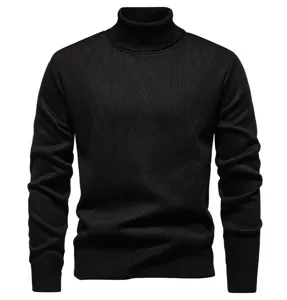 Close-up detail of mens black turtleneck sweater with diamond knit pattern and ribbed cuffs.