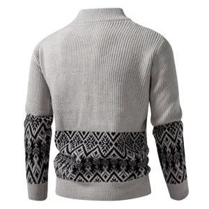 Detailed view of men's knit sweater back, featuring mock neck and geometric pattern sleeve.