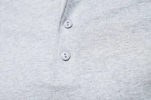 Close-up view of men's casual Henley t-shirt button collar and soft fabric texture.