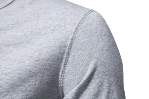Close-up detail of men grey t-shirt shoulder fabric and fine stitching craftsmanship