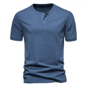 Men's blue short sleeve Henley t-shirt fabric detail and collar buttons close-up view.