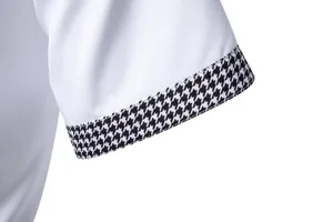 Vista dettagliata della manica di camicia casual con polsino in pied-de-poule elegante.