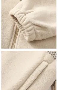 Close-up detail of mens fleece jacket cuff, zipper and pocket with ethnic print style.