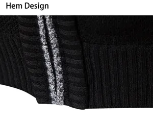 Close-up detail of mens knitted jacket hem, black fabric with stylish contrast stripe trim.