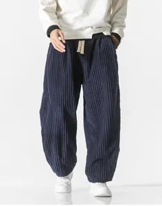 Men's loose corduroy casual pants detail view, soft fabric texture and comfortable waist design.