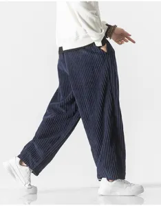 Detailed side view of men's loose corduroy trousers showing soft textured fabric and casual fit.