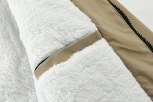 Detail view of men's winter fleece lined jacket interior showing sherpa and zipper.