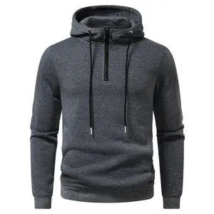 Men's dark grey quarter-zip hooded sweatshirt with black drawstrings and casual long sleeves.