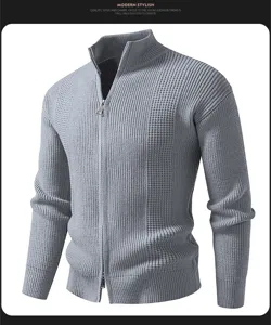 Close-up view of men's grey knitted zip-up cardigan featuring high collar and textured fabric.