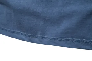 Close up view showing the detailed stitching and soft fabric texture of a solid color t shirt.