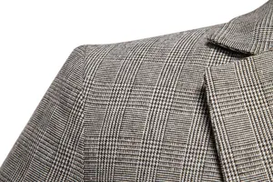 Dettaglio blazer casual a quadri da uomo, tessuto in lana da abito retro primo piano