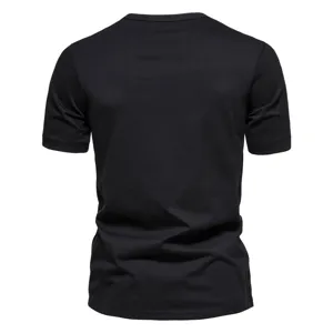 Back view detail of men's plain black short sleeve t-shirt, soft fabric, classic cut.
