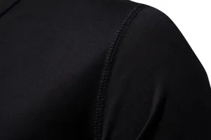 Close-up detail of black cotton t-shirt shoulder seam showing neat stitching and fabric.