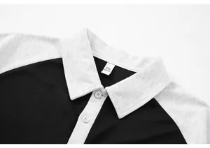 Casual color block short sleeve polo shirt for men and women, loose fit design detail.