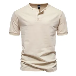 Beige men's short sleeve Henley t-shirt fabric details with buttons and collar tag.