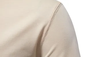 Close-up detail shot of men solid color t-shirt shoulder seam showing fine knitting fabric.
