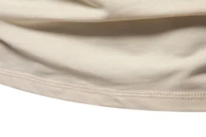Close-up detail of soft cotton fabric and neat hem stitching for men's solid color t-shirt.