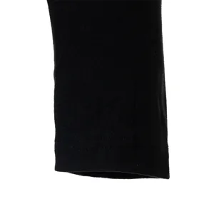 Black thermal velvet long sleeve shirt cuff detail view showing fine stitching work.