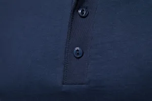 Close up of dark blue men solid color henley shirt placket and buttons detail cotton fabric.
